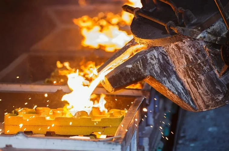 Molten metal casting in an industrial metallurgical processing facility