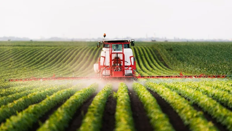 Agricultural field spraying representing agrochemical intermediates produced with aluminum chloride catalysis