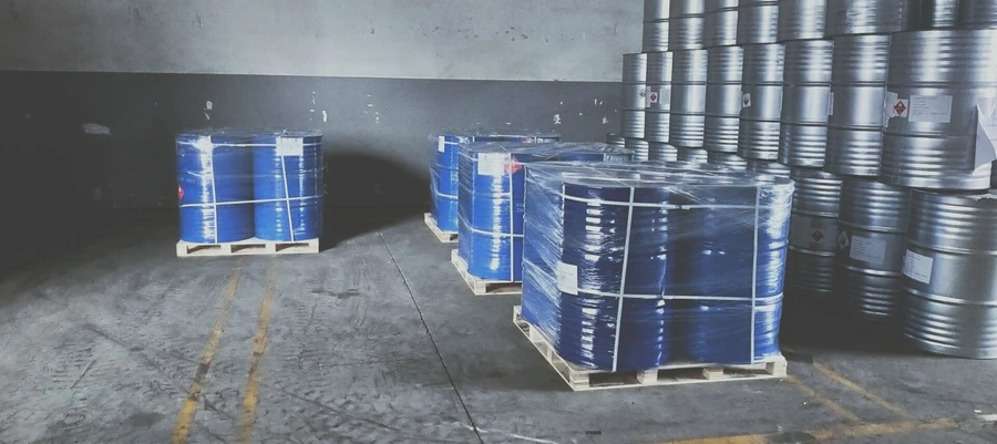 Acetyl Tributyl Citrate ATBC chemical drums stored on pallets in a warehouse