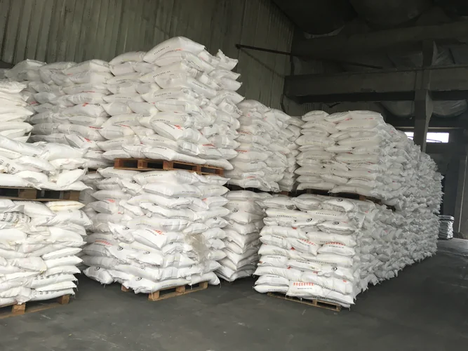 Moisture-resistant chemical bags stored on pallets in an industrial warehouse