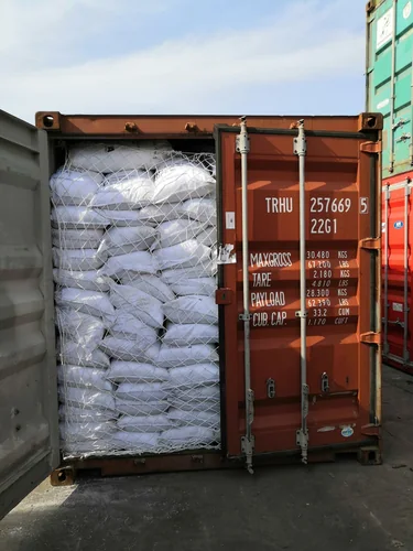 Export container loaded with sealed chemical bags for international shipment