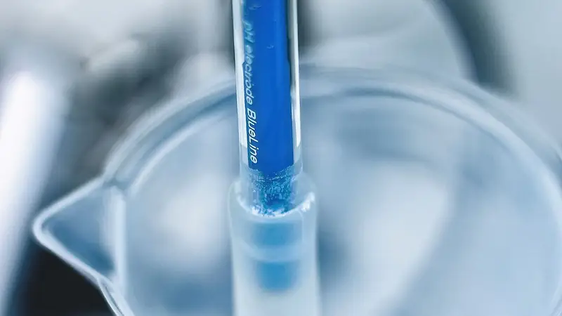 Laboratory pH electrode testing a liquid sample for TSPP quality control